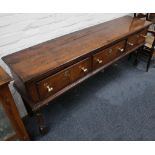 A Georgian oak Lancashire dresser base, composed of three drawers over turned legs, 206cm w x 41cm d