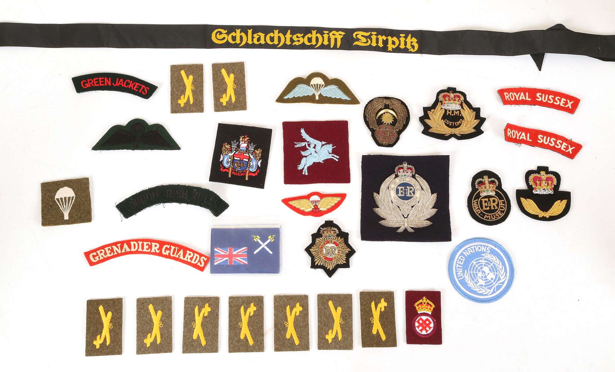 Cloth shoulder titles, bullion badges, sabretache bullion badges and other military badges