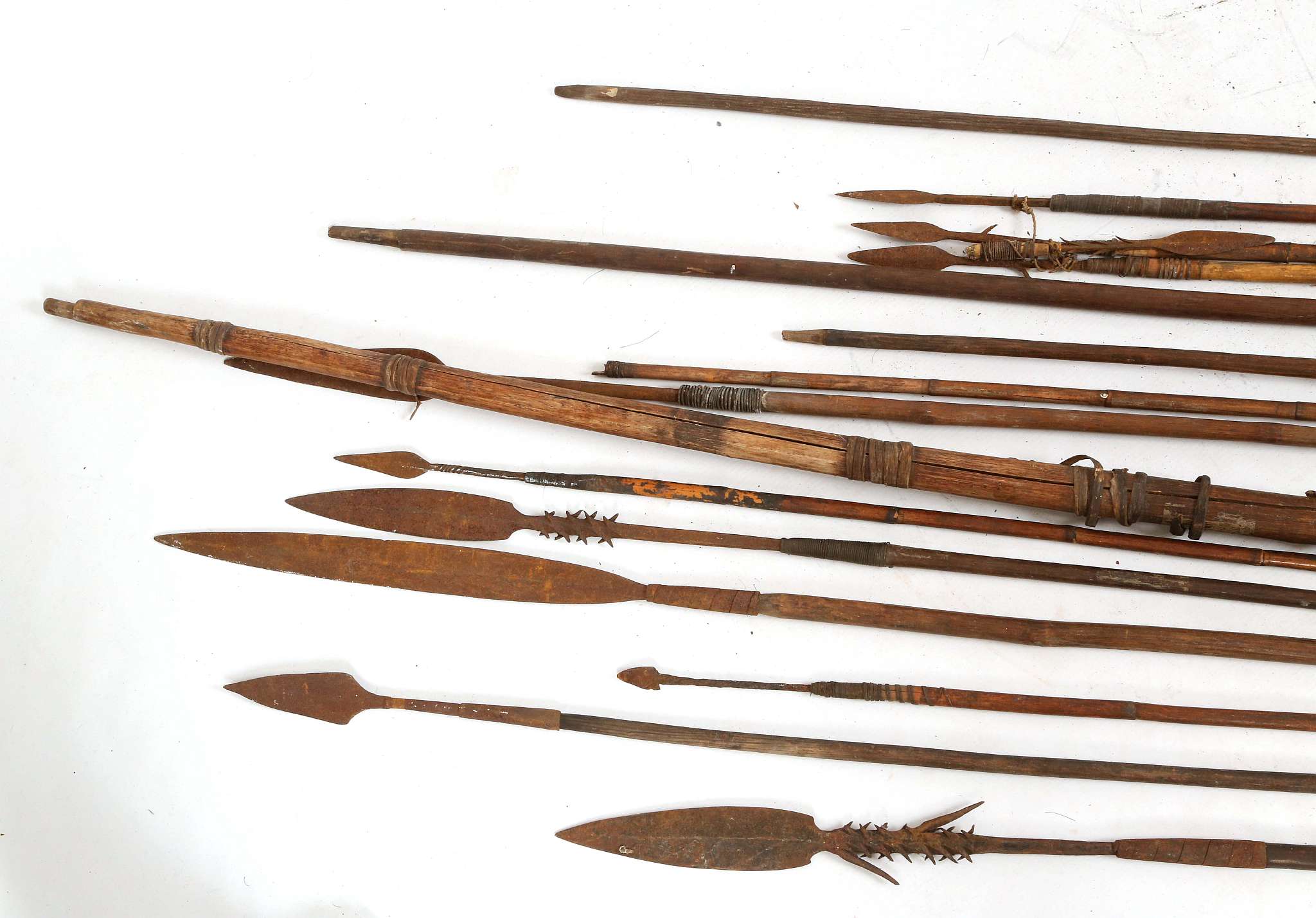 A tribal bow, split wood with grass banding, arrows, throwing spears with feather blade and barb - Image 3 of 5