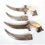 Two Indo Persian Khanjar daggers; niello horse head pommel, bone grip, cruciform quillon, Damascus
