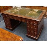 A mid Victorian desk, green tooled leather insert,