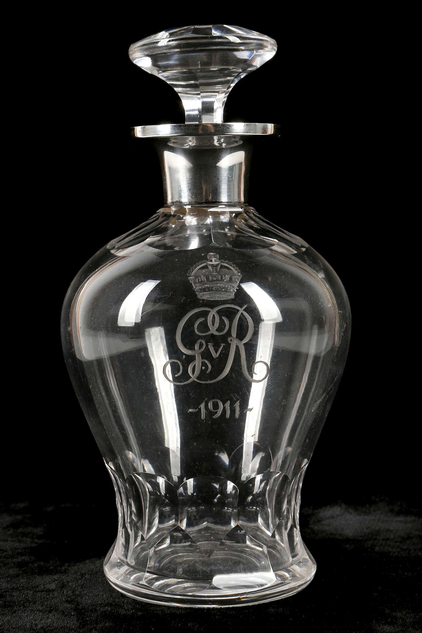 An early George V period novelty crystal cut glass decanter and stopper, having hallmarked silver