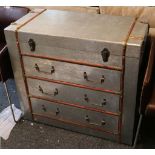 A contemporary 'distressed' aluminium aviation chest with three drawers and a foot locker style