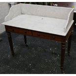 A Victorian wash stand, marble splash back and top double drawers, turned legs, brass castors