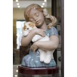 A large Lladro ceramic figure of a girl holding a