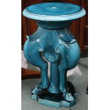 A 19th Century Majolica jardinière stand, all over turquoise glaze, on hoofed leg supports