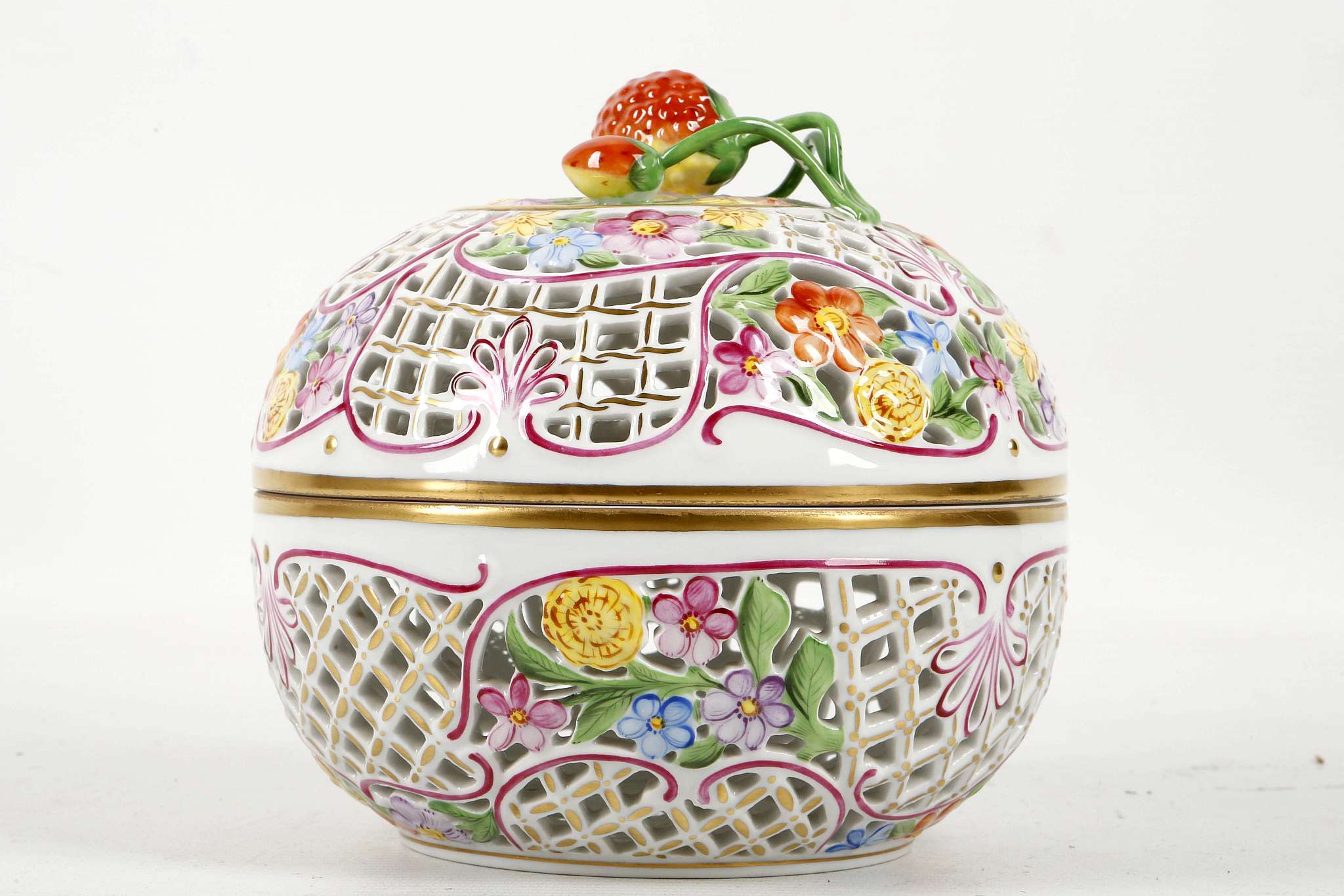 A Herend porcelain, almost spherical pierced bowl, cover painted with flowers and with an applied