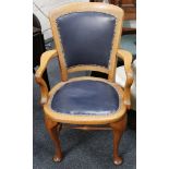 A light oak desk chair, later leather back and seat, pad feet, c.1920