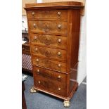 A good flame mahogany pedestal chest on chest of seven silk lined graduated drawers, on carved and