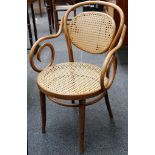 A set of 8 bistro chairs, bentwood arms, ratton back and seat, tapering turned legs