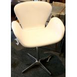 A white leather 'swan' swivel chair