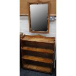 A satinwood dwarf floor standing open bookcase, and a satinwood framed bevelled mirror en suite (the