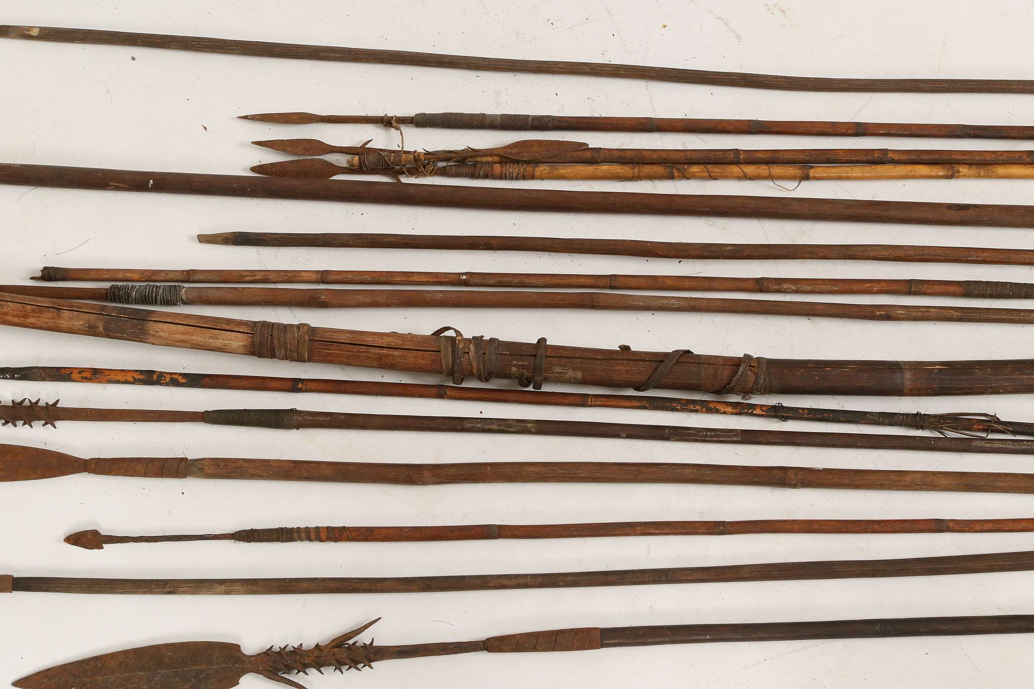 A tribal bow, split wood with grass banding, arrows, throwing spears with feather blade and barb - Image 4 of 5