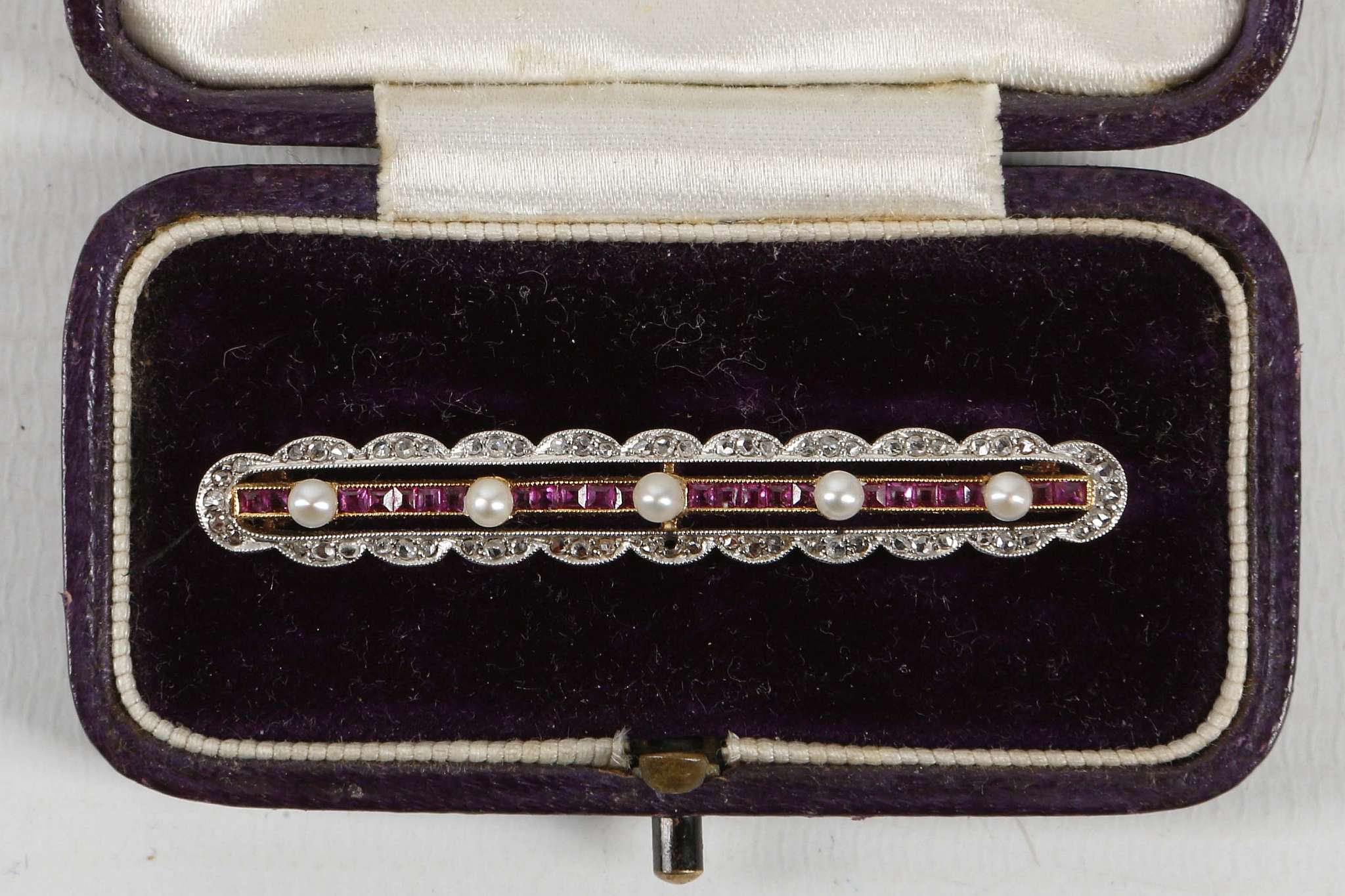 A 19th Century 18ct gold, ruby, diamond and pearl set bar brooch