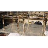 A pair of brass framed glass topped low tables