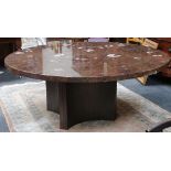 A fossil marble topped circular dining table, 182cm diameter