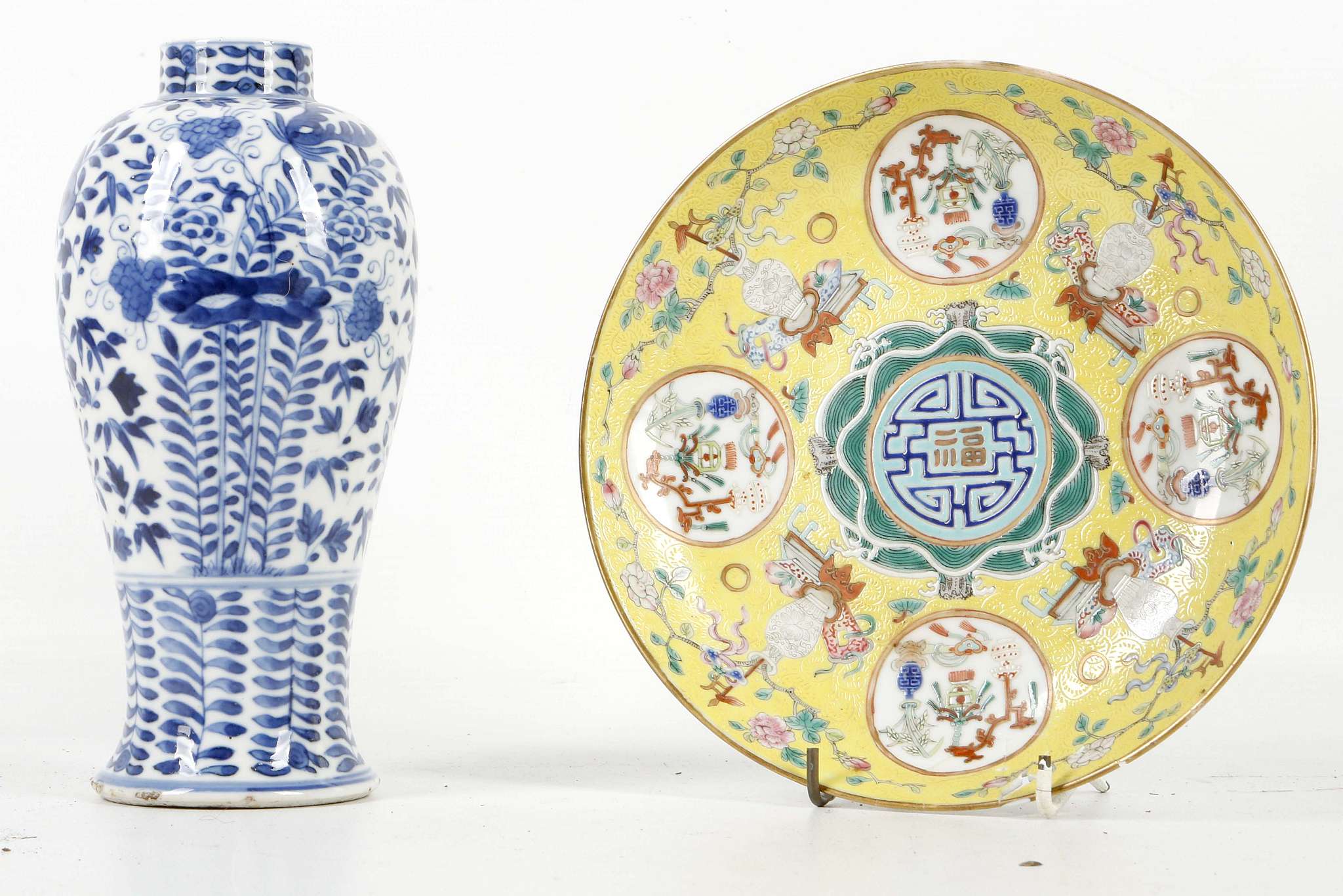 A 19th Century Chinese baluster form vase with blue and white foliate / floral decoration, bears