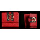 GUCCI WALLET, bright red grained leather with central canvas stripe and gilt metal logo, 12cm x 11cm