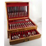 A comprehensive canteen of silver plated cutlery for twelve, in oak case, lacking one fork