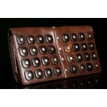 YVES SAINT LAURENT RIVE GAUCHE CLUTCH, brown kid leather applied to one side with wood squares, 31cm