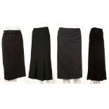 FOUR DESIGNER SKIRTS, to include a Gucci pinstripe example, size 46, a brown Gucci example, size 46,