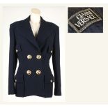 A GIANNI VERSACE COUTURE JACKET, 1980s, navy blue with large gilt metal Medusa head buttons,