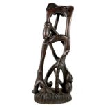 An early 20th Century, unusual central African ebony carving of an abstract human figure, inspired
