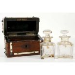 A pair of miniature Victorian cut glass and gilt bottles in a fitted wooden box