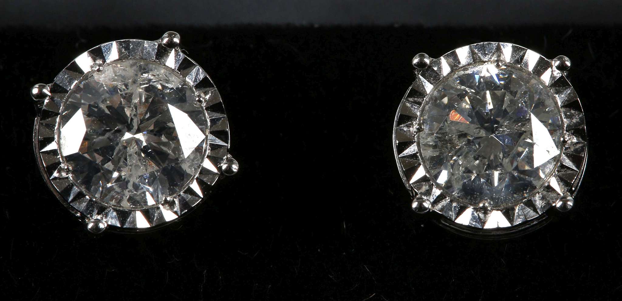 An 18ct white gold screw back pair of diamond stud earrings, 2.17ct