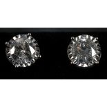 An 18ct white gold screw back pair of diamond stud earrings, 2.17ct