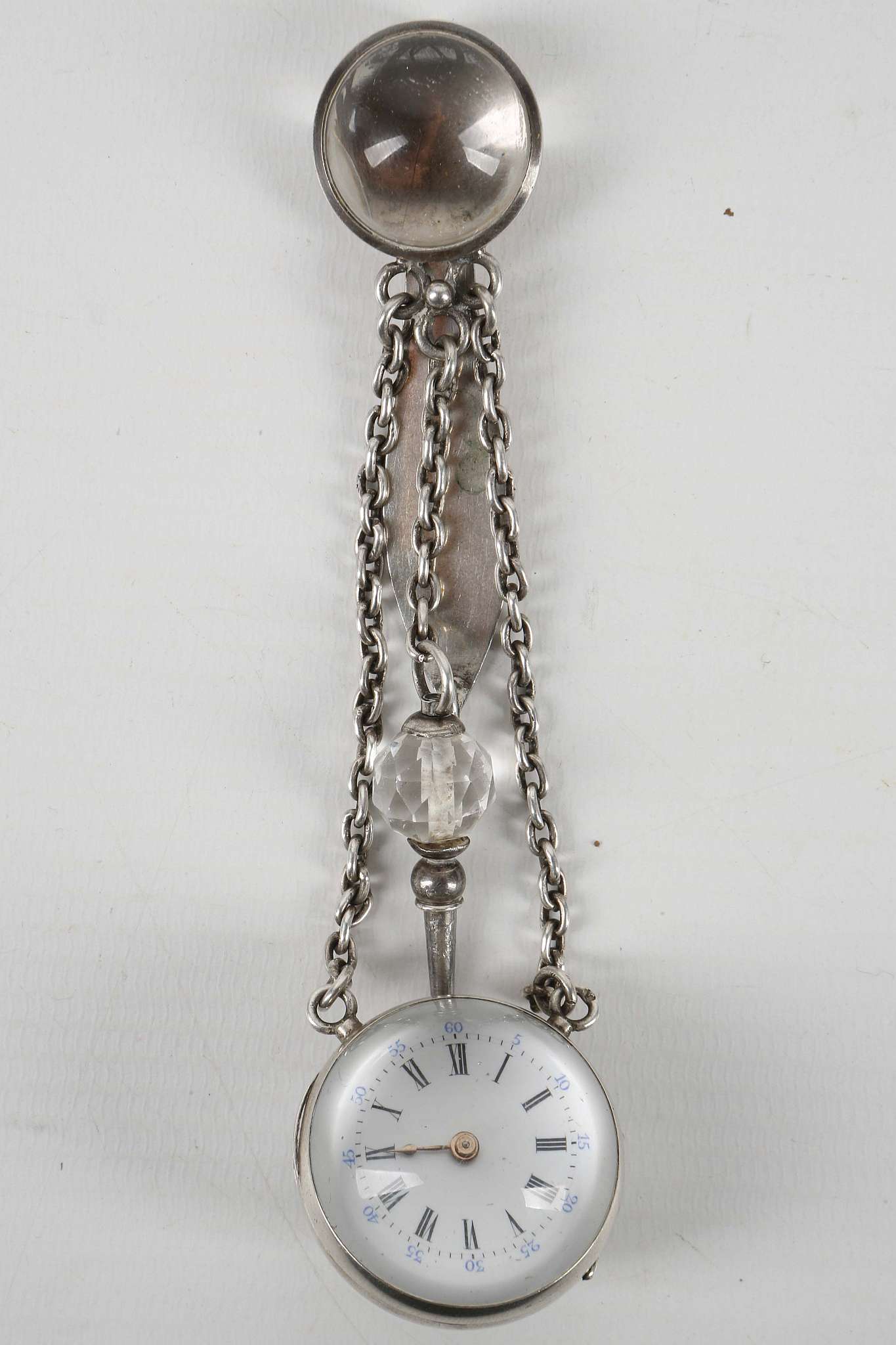 A sterling silver pendant watch on chain with attached clip and key