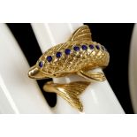 An 18ct gold and sapphire set dolphin form dress ring