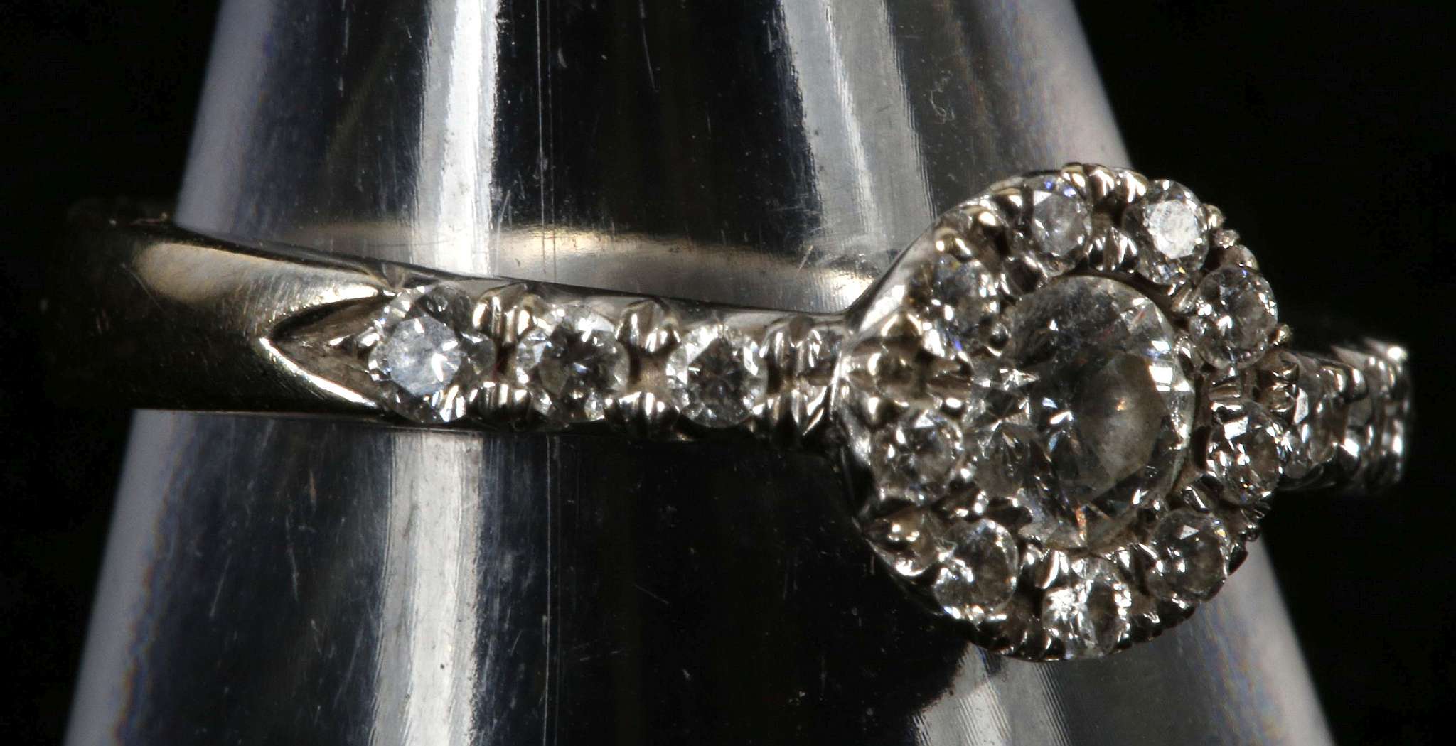 An 18ct white gold and diamond cluster ring