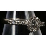 An 18ct white gold and diamond cluster ring