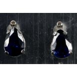 A pair of 14k white gold, diamond and sapphire set earrings (Note: sapphires presumed treated?)