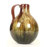 A LINTHORPE JUG, with green and yellow slip glaze,