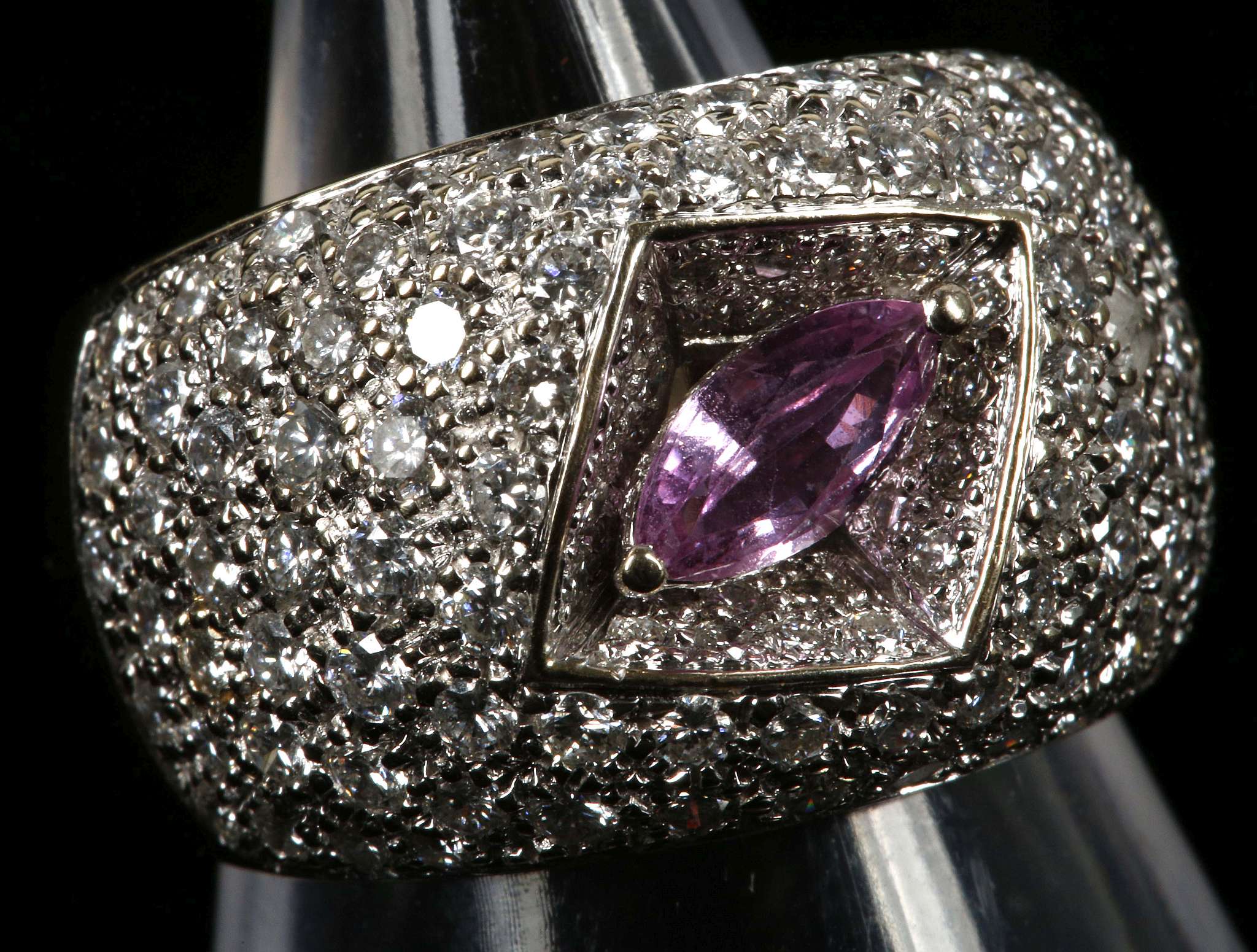 An 18ct white gold, pink sapphire and pave diamond dress ring