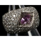 An 18ct white gold, pink sapphire and pave diamond dress ring