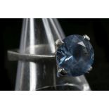 A c.1970's 14k white gold and topaz set solitaire dress ring