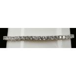 An 18ct white gold and diamond set line bracelet, diamond: 6.61cts