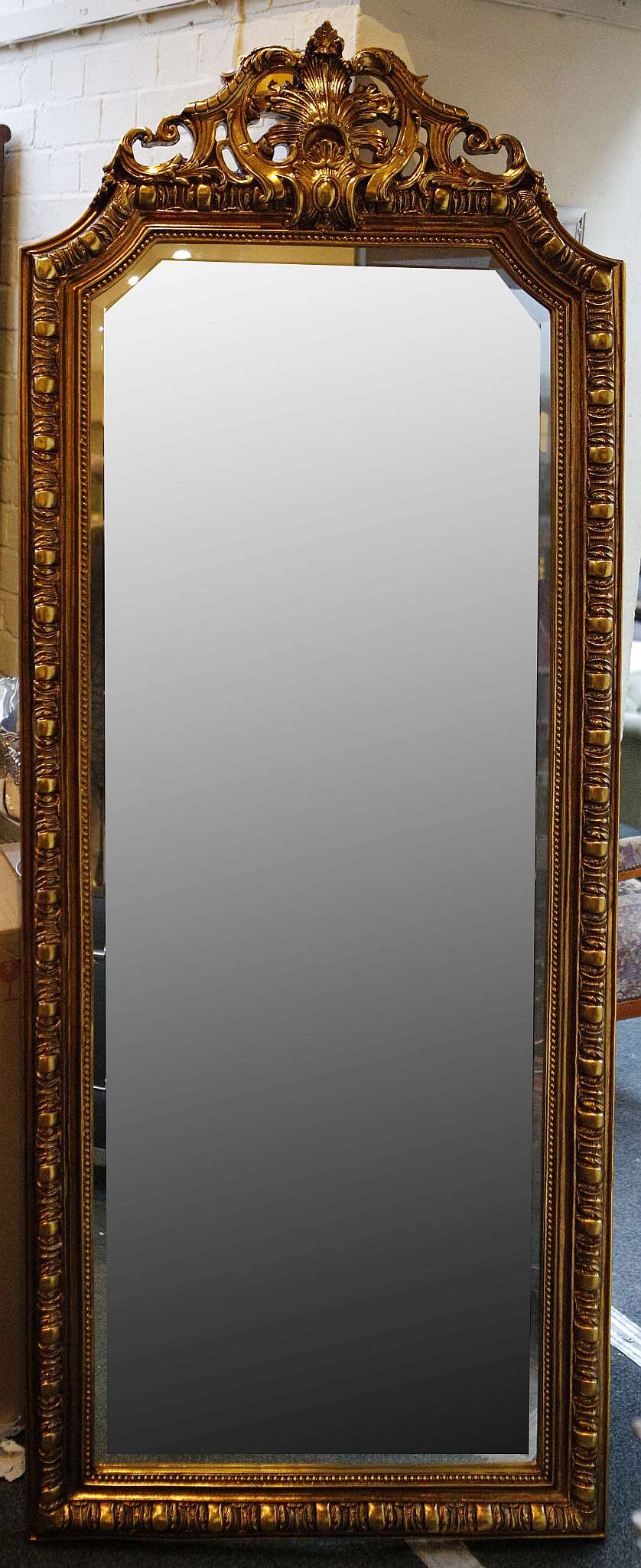 A large mirror with an ornate gilded frame in the French style, 190 x 76cm (with frame)