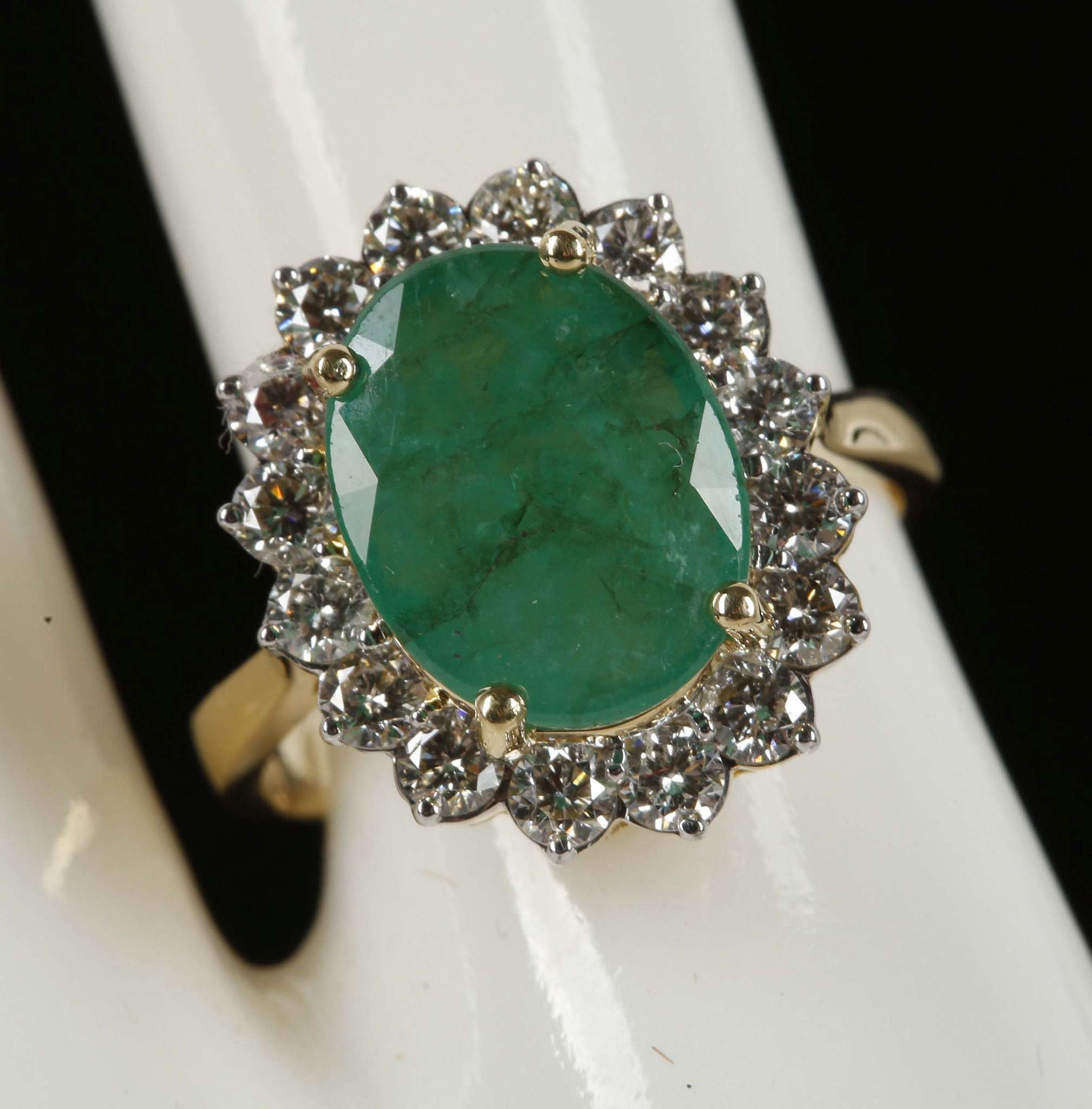 An 18ct white gold, large emerald, diamond cluster ring, emerald: 3.93ct, diamond: 1.02ct