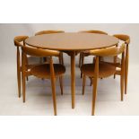 HANS WEGNER FOR FRITZ HANSEN, a tripod table with six 'Heart Chairs', circa 1960, in teak and