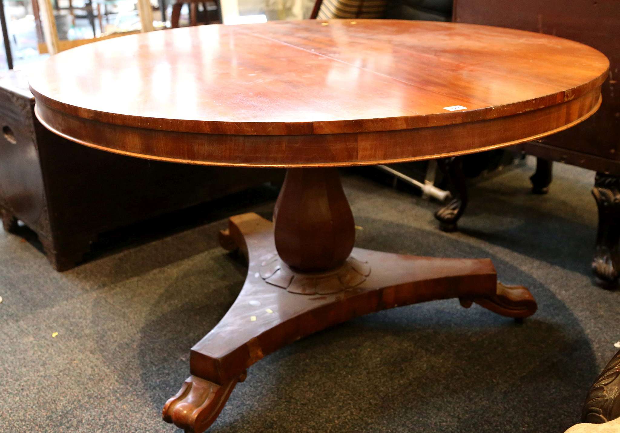 A Victorian mahogany circular dining table, on ped