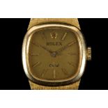 A ladies 18ct gold Rolex orchid dress watch, with gilt dial, batons and integral textured bracelet