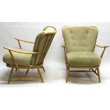 A PAIR OF ERCOL ARMCHAIRS, in beech wood.