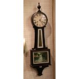 An American keyhole shape wall clock, with verre eglomise panels and chiming movement