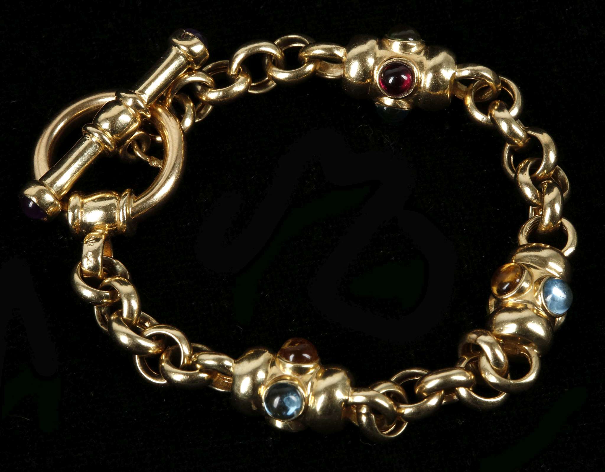An 18ct gold fancy link bracelet, set with cabouchon garnets, citrine, topaz and peridot