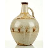 DANLAMI ALIYU, a 1960's studio pottery single handled oil jar with lid, probably produced at the