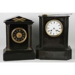 A Victorian black marble mantel clock with enamel